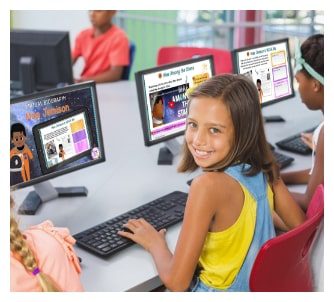 Smiling female elementary student working on a digital virtual field trip experience in her classroom.